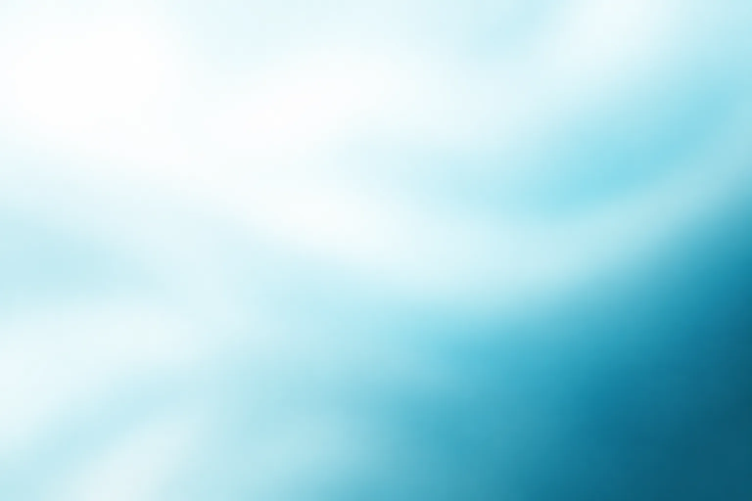 A soft, blurred white and pale-cyan light field.